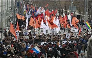 Several thousand Russian opposition supporters gathered for a protest on Sunday, venting anger against the Kremlin and demanding the release of political prisoners.