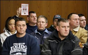 A large group of Toledo firefighters attend the arraignment of Ray Abou-Arab in Toledo Municipal Court. Mr. Abou-Arab is charged with aggravated arson and two counts of aggravated murder in the deaths of Toledo firefighters Stephen A. Machcinski and James Dickman.