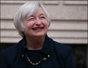 Janet Yellen smiles after being sworn in as Federal Reserve Board Chair, today in Washington.