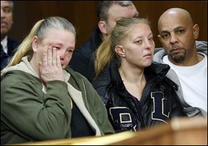 Tracy Bishop, left, Patricia Rollins, and Henry Robinson, who lived at the North Toledo apartment building where two Toledo firefighters were killed while battling a fire, attend the arraignment of apartment owner Ray Abou-Arab on Monday in Toledo Municipal Court.