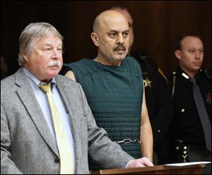 Ray Abou-Arab, with his attorney James MacHarg, left, is arraigned in Toledo Municipal Court today.
