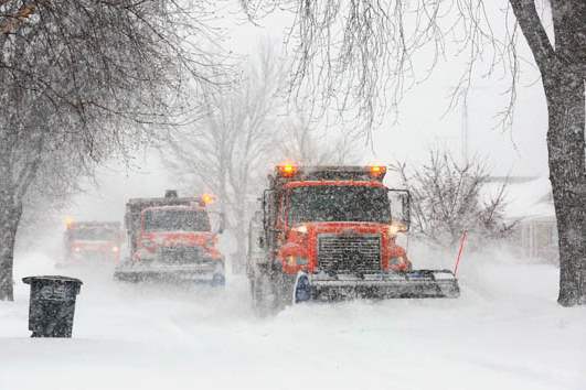 A-trio-of-snow-plows-work-to-clear-290th-Stre