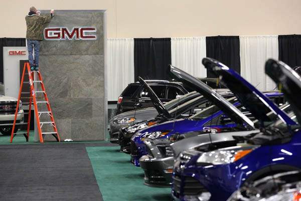 GMC-sign-receives-a-final-polishing-as-Ford-s-cars-are-lined-up