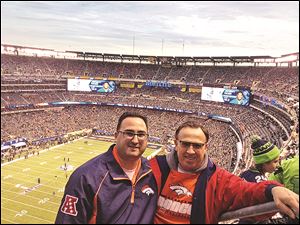 Larry Boyer of Toledo, right, at the Super Bowl with his son Tim Boyer