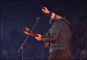 Zac Brown holds the microphone to the sold-out audience at Huntington Center on Wednesday.