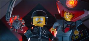 The character Bad Cop/Good Cop, voiced by Liam Neeson, left, and President Business, voiced by Will Ferrell, in a scene from 