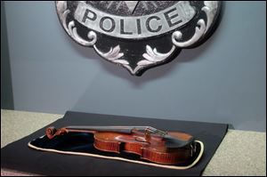 A $5 million Stradivarius violin is displayed at the Milwaukee Police Department.