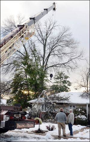 Falling limbs from a tall oak tree damaged a home in Frederick, Md. after Wednesday's ice storm.