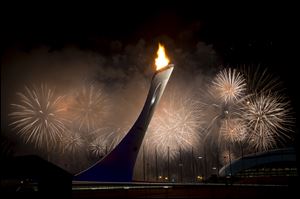 Fireworks explode behind the Olympic torch after it was lit at end of the opening ceremony for the 2014 Winter Olympics in Sochi, Russia today.
