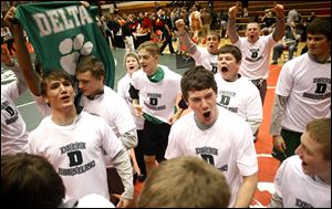 Delta High School wrestlers celebrate their win over Dayton Christian following action of the Ohio High School Athletic Association's Dual Team Wrestling State Tournament.