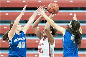 Anthony Wayne's Sara Zankl, left, and Abby Allen surround Central Catholic's Demi Russell. 