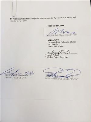 A signature of Mayor Michael Bell is cut and pasted on a document. Toledo police are investigating the possible forgery of signatures of Mr. Bell and others.