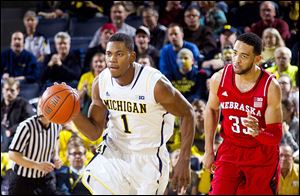 Michigan’s Glenn Robinson III gets past Nebraska’s Walter Pitchford. The Wolverines have lost two of their last three games.