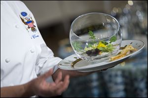 White House Executive Chef Cris Comerford holds the 