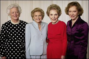 Former first ladies from left, Barbara Bush, the late Betty Ford, Nancy Reagan, and Rosalynn Carter gather for a photo at a fund-raising event saluting Betty Ford and the Betty Ford Center in 2003.