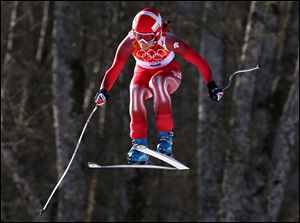 Switzerland's Dominique Gisin makes a jump in the women's downhill at the Sochi 2014 Winter Olympics, today in Krasnaya Polyana, Russia.