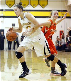 Sylvania Northview player Kendall McCoy (40) drives past Sylvania Southview player Maria Pappas (12) during the fourth quarter.