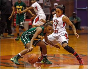 Start's Marquasia Turner is guarded closely by Rogers' Brelynn Hampton-Bey in Saturday’s game.