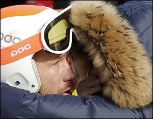 Bode Miller is consoled by his wife, Morgan, after his race. The bronze on Sunday is Miller’s sixth career medal and ties him for being the most decorated U.S. Winter Olympian with Bonnie Blair.