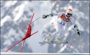 Bode Miller makes a jump in the men’s super-G. He tied for bronze for his first medal of the Games.