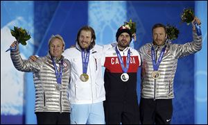 American Andrew Weibrecht, left, took silver in the men’s Super-G while Norway's Kjetil Jansrud took gold. Bode Miller, right, and Canada's Jan Hudec tied for bronze on Sunday.