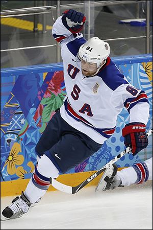 American forward Phil Kessel celebrates his goal against Slovenia on Sunday. He finished with a hat trick.