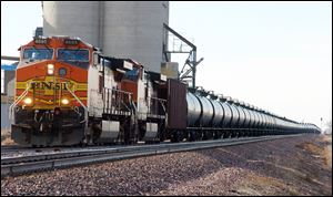 A BNSF Railway train hauls crude oil near Wolf Point, Mont. With potentially explosive shipments increasing 40-fold as crude production booms, the railroad industry, at the urging of the Obama Administration and U.S. and Canadian safety officials, is considering  a closer look at industry risks.