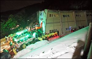Rescue workers search for survivors from a collapsed resort building in Gyeongju, South Korea, today. 