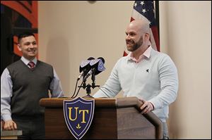 Navy Reserve Lt. Heraz Ghanbari, left, and Donald Hill, a veteran and local businessman, speak at a workshop at the University of Toledo, where Lieutenant Ghanbari is the military liaison.