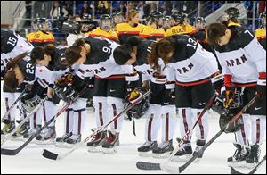 Members of team Japan bow after their 3-2 loss to Germany today in Sochi, Russia.