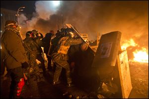 Anti-government protesters clash with riot police in Kiev's Independence Square, the epicenter of the country's current unrest.