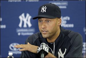 New York Yankees shortstop Derek Jeter gestures during a news conference today in Tampa, Fla. Jeter has announced he will retire at the end of the 2014 season.
