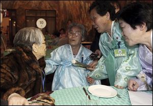 South Korean Kim Sung-yoon, 96, left, talks with her North Korean family members during the Separated Family Reunion Meeting at Diamond Mountain resort in North Korea, today.