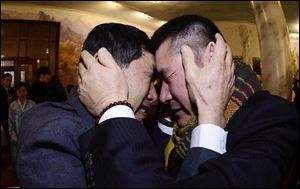 South Korean Park Yang-gon, left, and his North Korean brother Park Yang Soo get emotional as they met during the Separated Family Reunion Meeting today.
