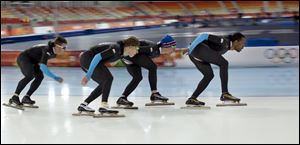 U.S. speed skaters Joey Mantia, Brian Hansen, Jonathan Kuck and Shani Davis, from left to right, practice for the team pursuit at Adler Arena Skating Center during the 2014 Winter Olympics, Monday in Sochi, Russia.