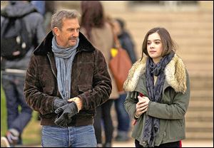 Kevin Costner, left, and Hailee Steinfeld in a scene from ‘3 Days to Kill.’