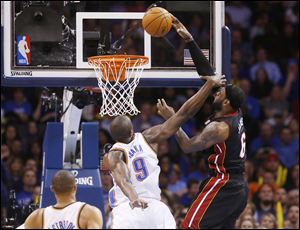 LeBron James fell to the floor with a bloody nose after this block attempt by the Thunder's Serge Ibaka.