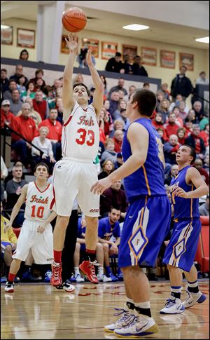 Central’s Tom Vetter knocks down a 3-pointer while Findlay's Austin Gutting, foreground, looks on in Friday’s matchup.