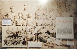 A mention of Moses Fleetwood Walker (back row, center) was included in a timeline in this photo at the National Baseball Hall of Fame in Cooperstown, N.Y., but it is dwarfed by Jackie Robinson’s tributes.