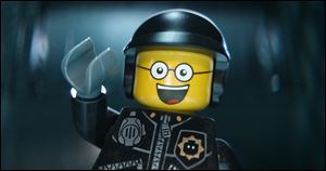 This image released by Warner Bros. Pictures shows the character Bad Cop/Good Cop, voiced by Liam Neeson, in a scene from 
