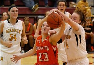 Southview's Taryn Stanley and Northview's Maddie Cole reach for a loose ball.
