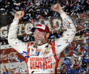 Dale Earnhardt, Jr., celebrates in Victory Lane after winning the Daytona 500 at Daytona International Speedway on Sunday. It was his second victory in NASCAR’s most famous race. He endured a rain delay of more than six hours.