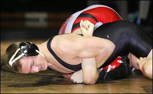 Delta’s Tyler Fahrer pins Wauseon Tre Campbell at the Perrysburg Invitational Tournament. Fahrer is 49-1 at 160 pounds.