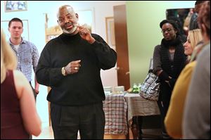 Former Toledo Mayor Mike Bell speaks at a StartUp Toledo meeting. He called for unity among Toledo residents on Thursday.