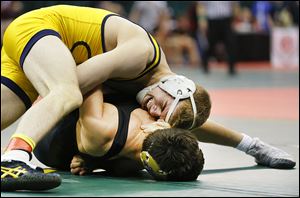 Archbold’s Logan Day looks to turn Joe Ziegler of Mechanicsburg in their 145 pound match. Day held off  Ziegler for a 3-0 decision.