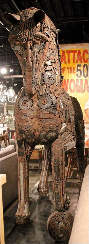 Leonardo is a massive sculpture made of recycled motorcycle and car parts by Cisco Brothers.