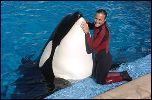 Dawn Brancheau, a whale trainer at SeaWorld Adventure Park, poses while performing in 2005. Brancheau was killed in an accident with a killer whale at the SeaWorld Shamu Stadium in February, 2010.