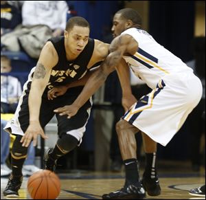 WMU's David Brown, 5, is defended by UT's Rian Pearson, 5.