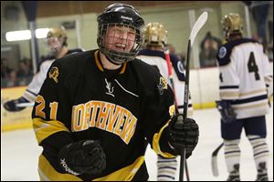 Northview's Josh Koback cheers after scoring to put the Wildcats ahead of St. John's during the third period. 