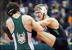 Delta’s Kyle Keller, right, tries to fend off Garrett Hancock of Troy Christian in the 120-pound final. He lost, but the Panthers earned their fifth team title.